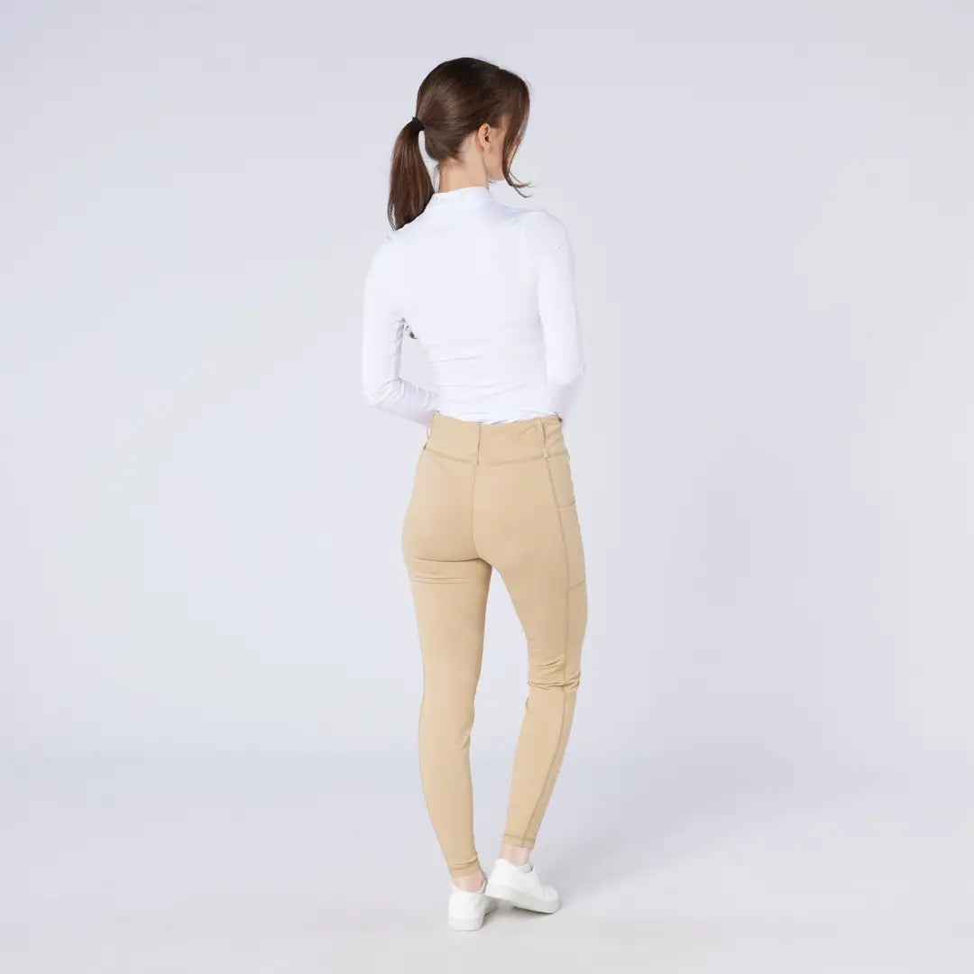 Women’s long-sleeve white mock neck shirt with tan leggings from Cameo All Season Tights for country clothing or hunting