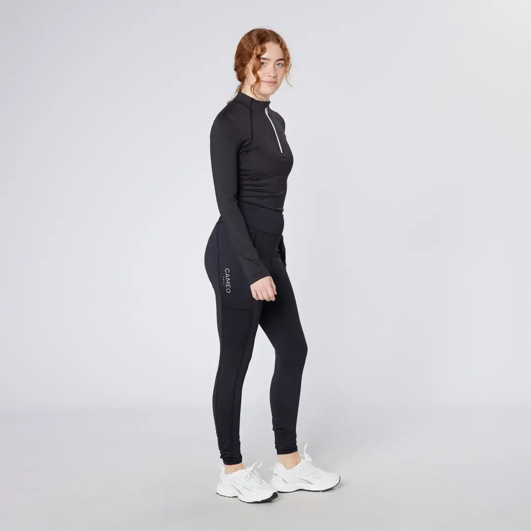 Woman in black athletic wear wearing Cameo Core Collection Tights for active look
