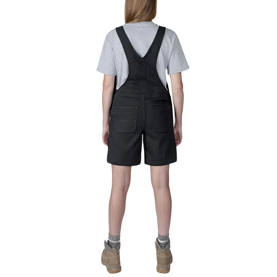 Woman in black overall shorts showcasing relaxed fit country clothing perfect for hunting