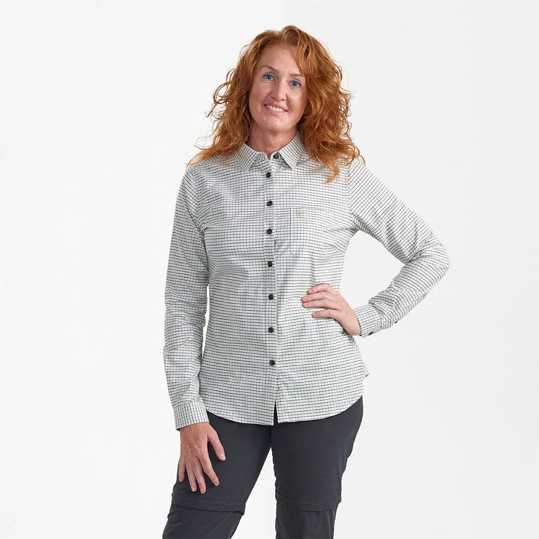 Woman wearing Deerhunter Lady Sara Shirt with checkered pattern and dark pants