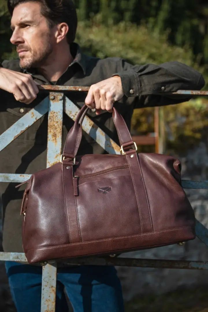 Brown leather Hoggs of Fife Monarch Carryon Holdall with gold hardware for country clothing and outdoors camping