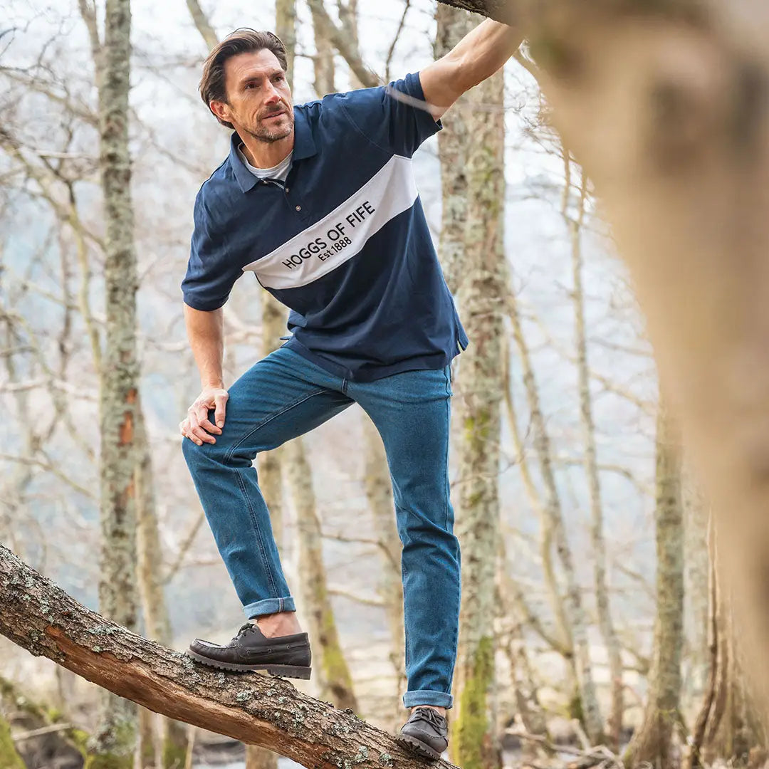 Man in navy and white polo shirt showcasing the Fife Stewart Block Pique style