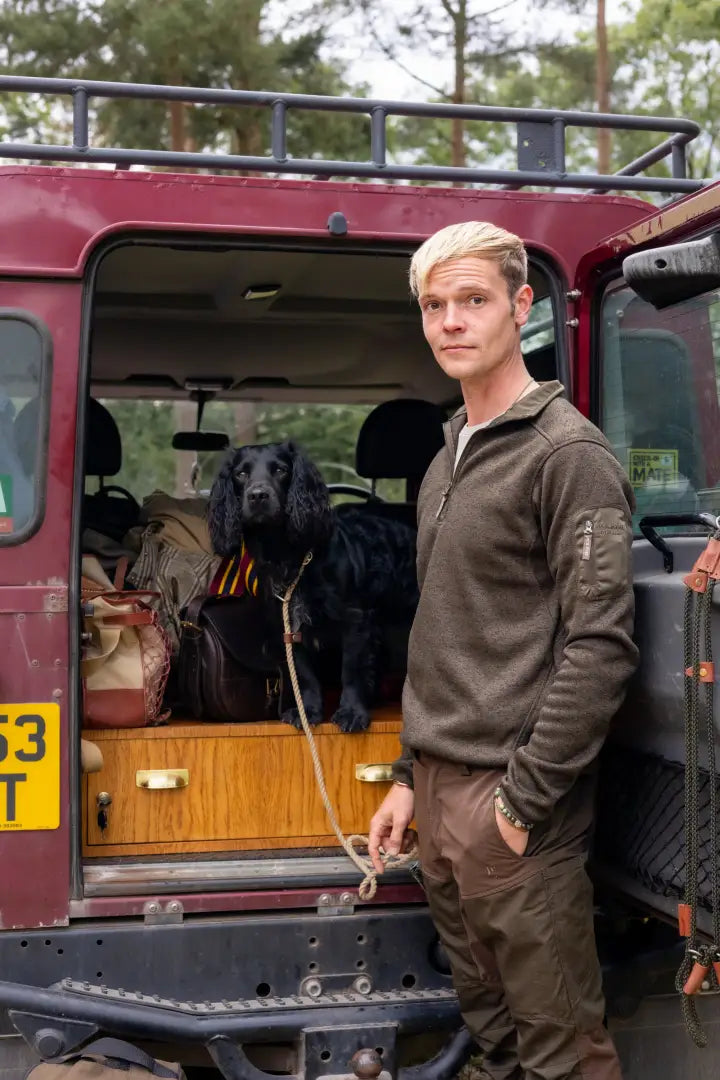 Maroon SUV with open back next to Jack Pyke Melange Quarter Zip Fleece