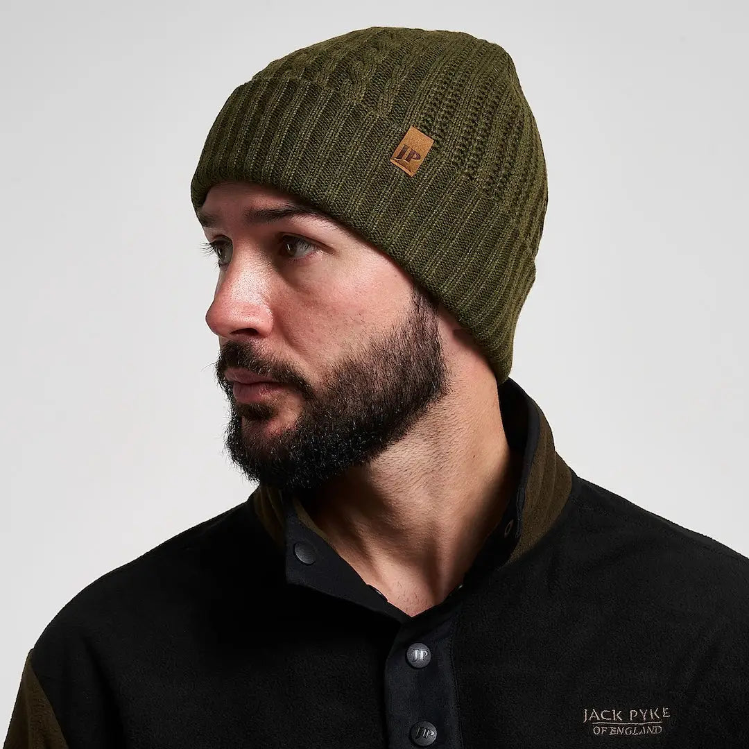 Jack Pyke olive merino wool beanie with brown leather tag, practical winter accessory