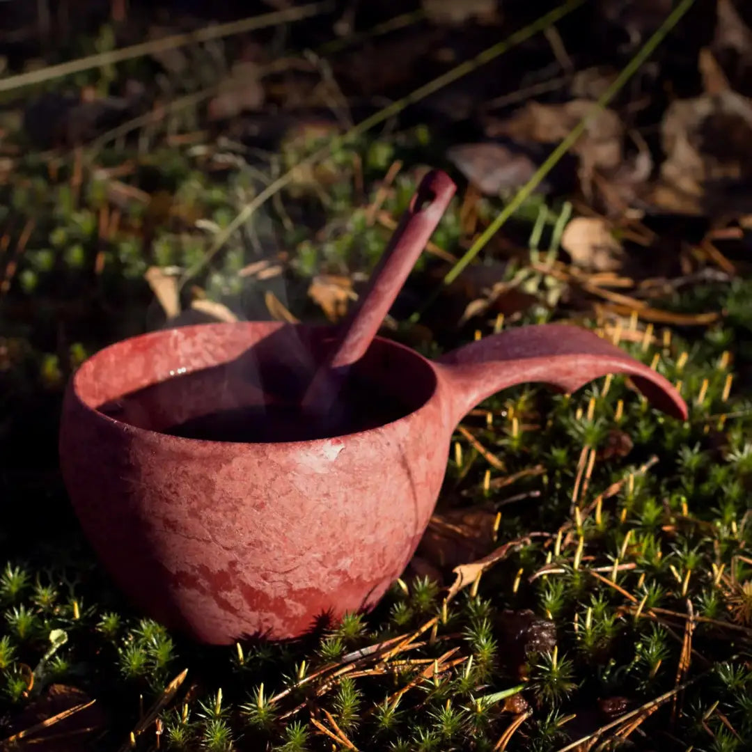 Reddish-brown Kupilka Classic Cup with handle and spoon, perfect for outdoors adventures