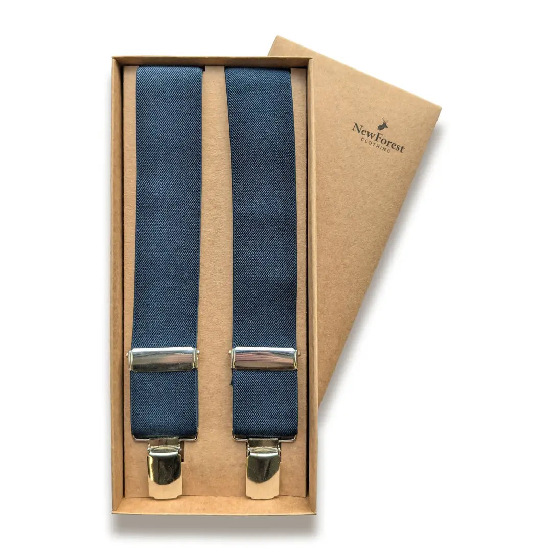 Navy blue suspenders in a box, perfect for country clothing and outdoor adventures