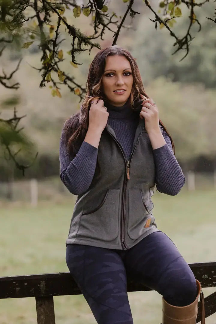 Woman in a gray vest wearing a stylish ladies fleece gilet for cozy comfort