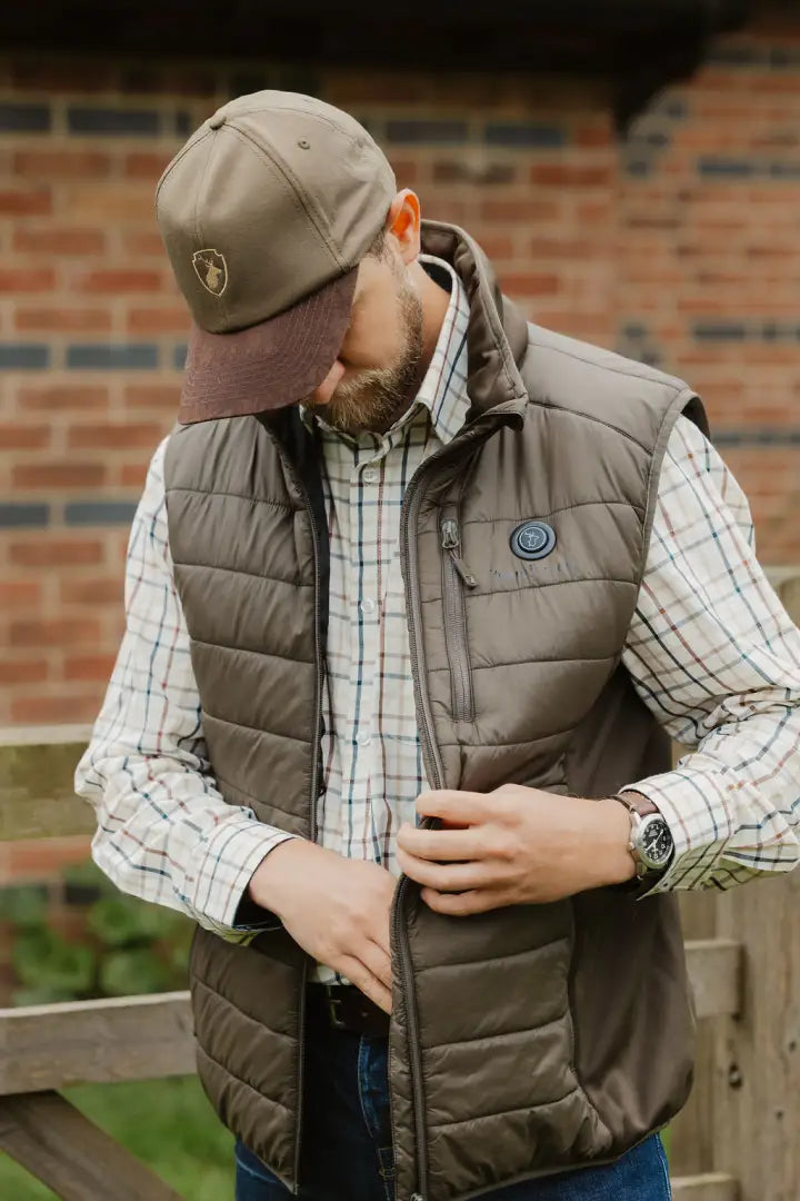Brown quilted vest paired with a New Forest Stag Baseball Cap for a stylish look