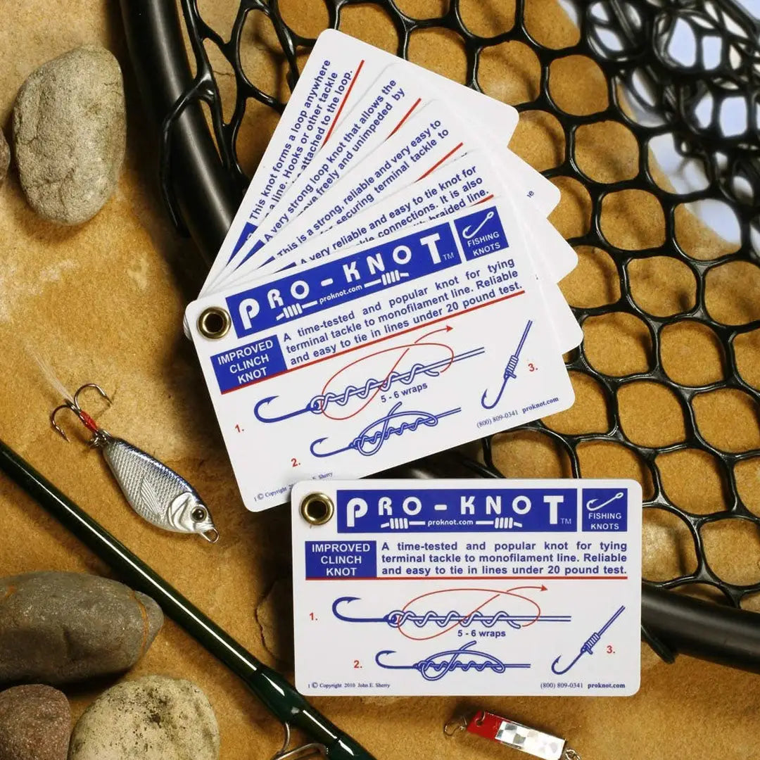 Stack of waterproof plastic fishing knot cards from Pro Knot Fishing Knots collection