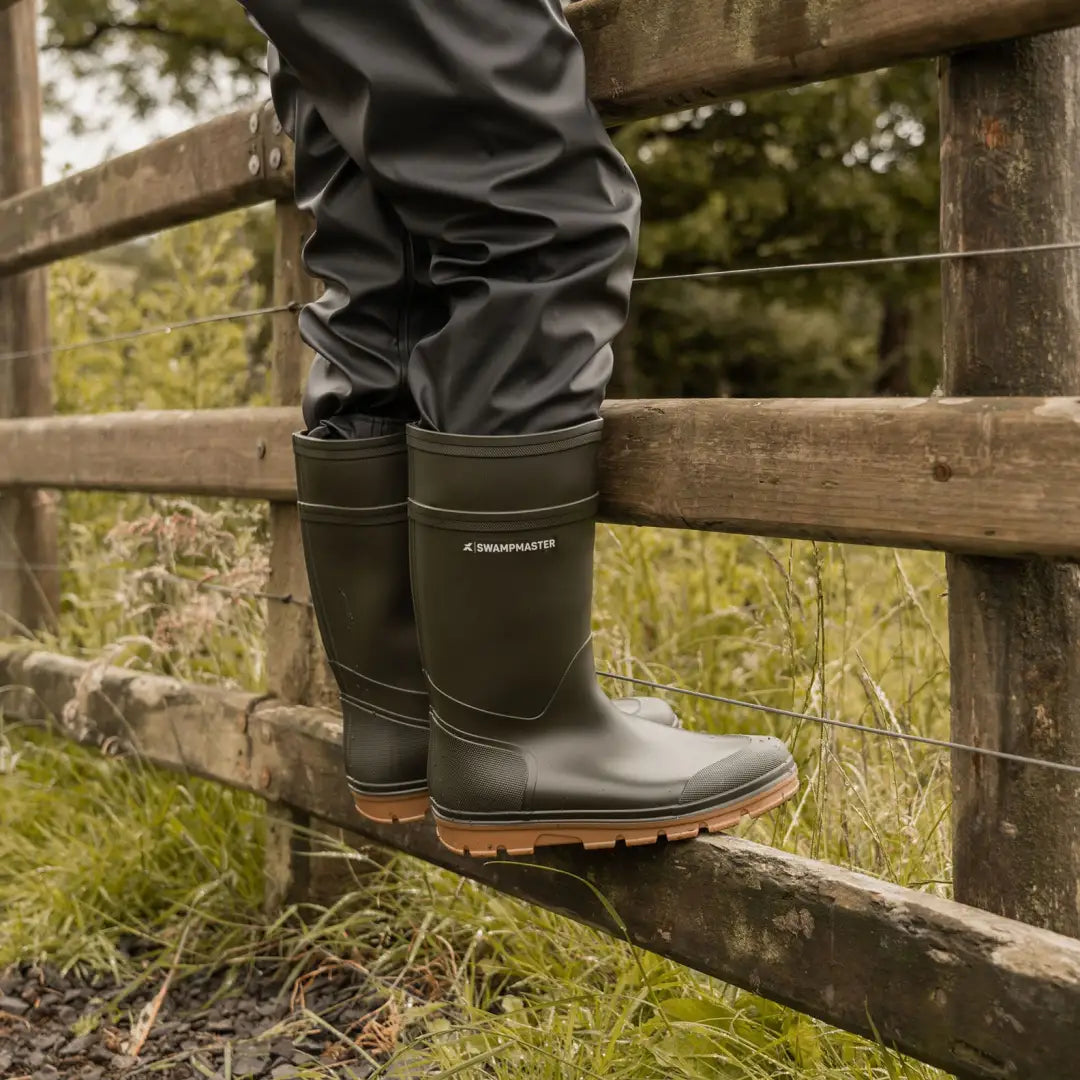 Dark green Swampmaster Stampede Junior Wellington rubber boots with tan soles for kids