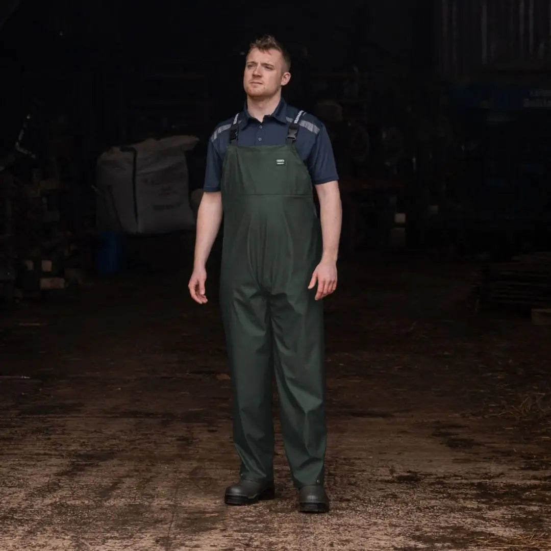 Man in Xpert Swampmaster waterproof bib overalls and navy work shirt for hunting