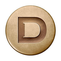 Beige circular emblem with raised D, perfect for Dublin equestrian apparel collection.
