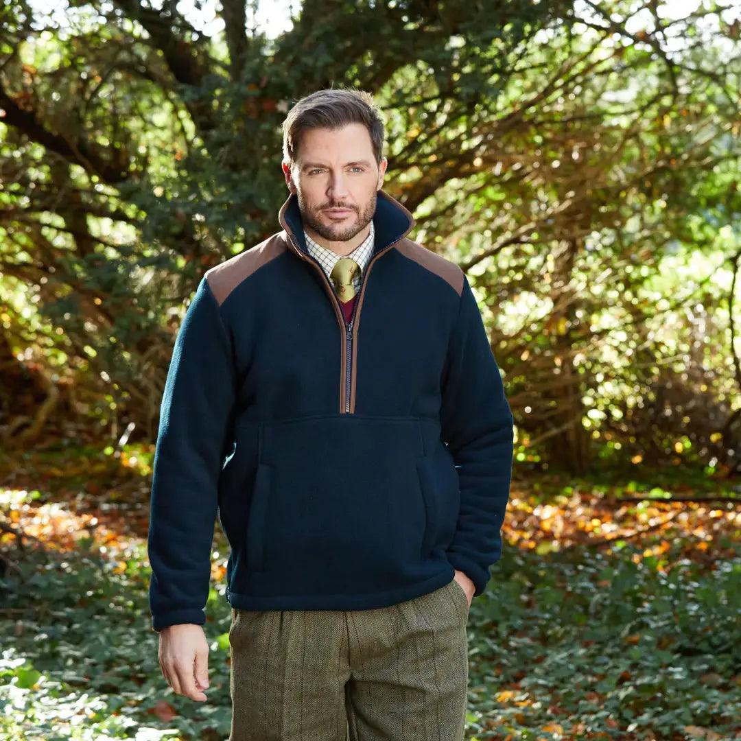 Man wearing alan paine aylsham half zip fleece with brown shoulder patches