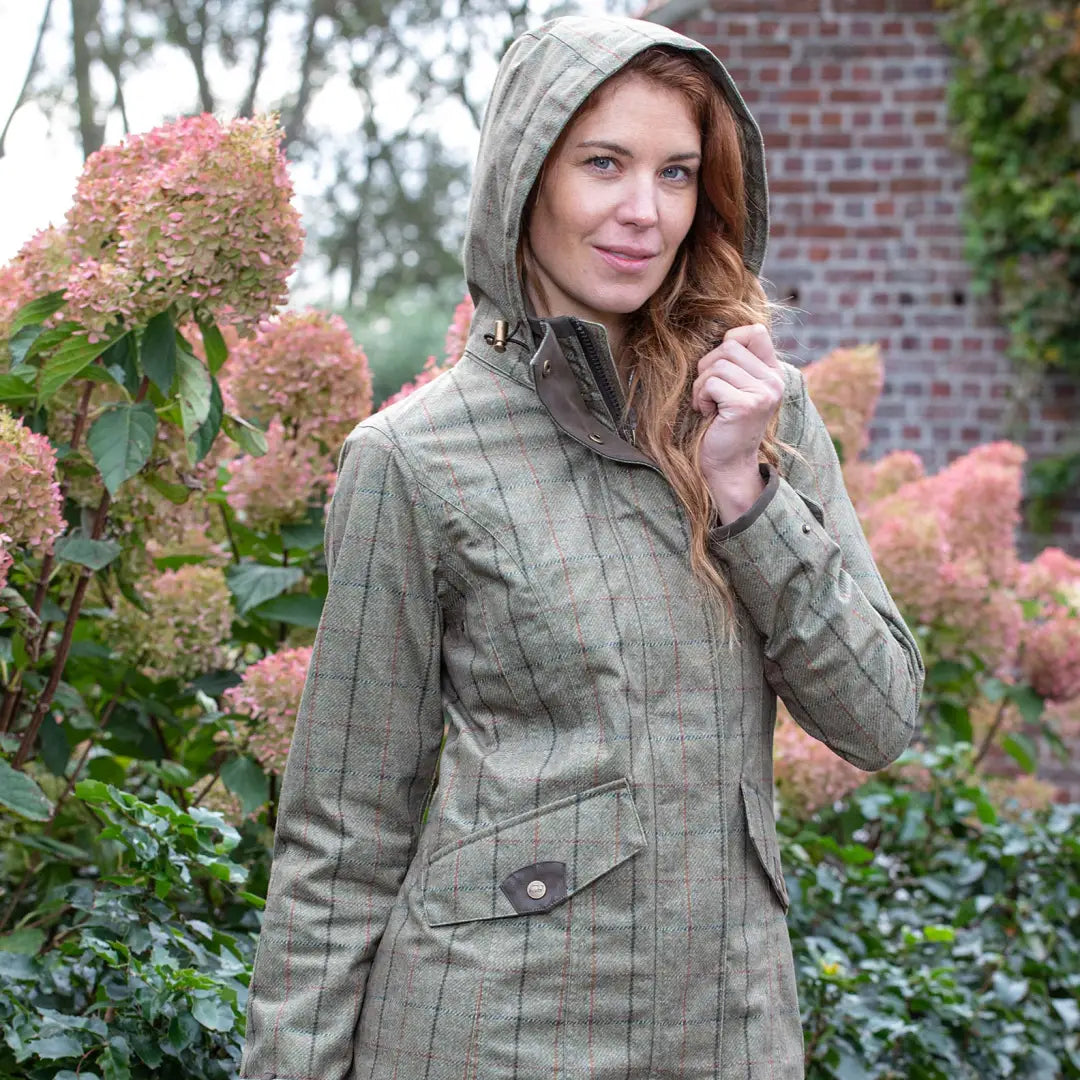 Woman wearing Baleno Twyford Ladies Printed Tweed Coat in olive green outdoors