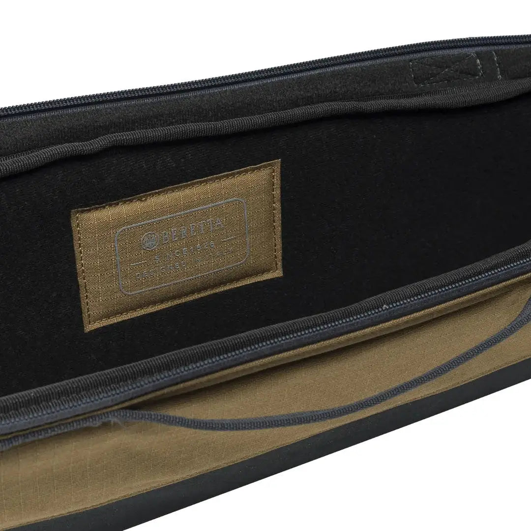 Open brown and black Beretta GameKeeper EVO gun case showing interior, fits various barrel lengths