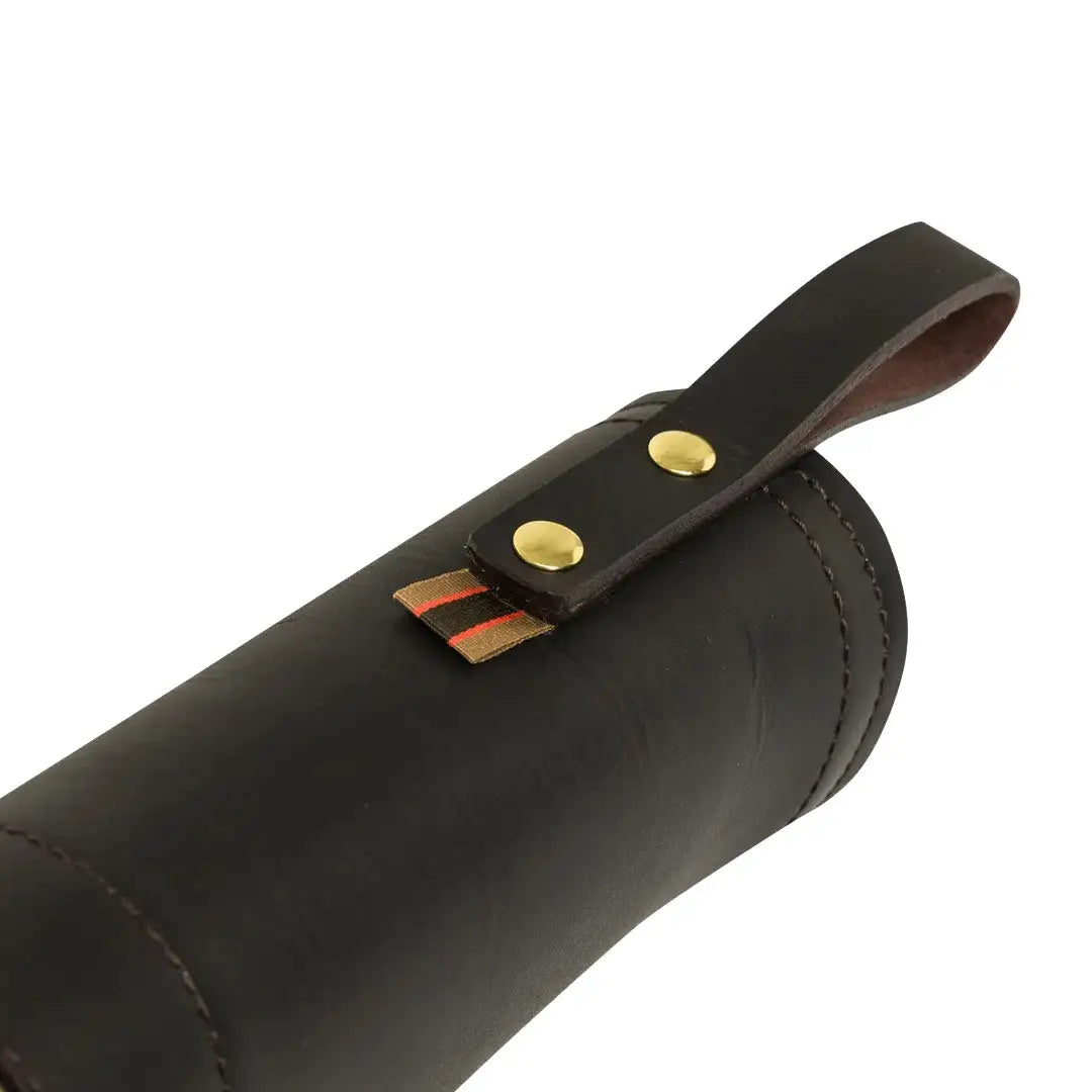 Dark leather cylindrical gun case with strap for hunting or country clothing style