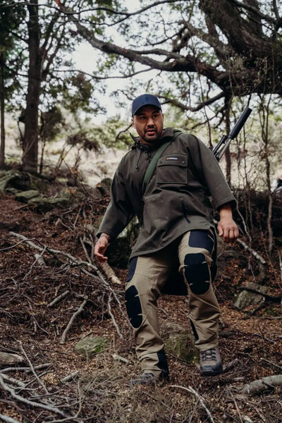 Hunter in outdoor gear wearing Bushbuck Huntsman Bushshirt for outdoor adventures