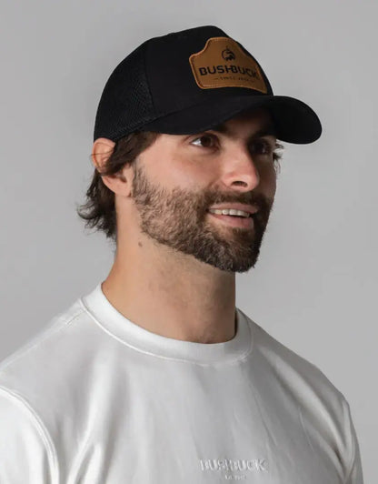 Black Bushbuck snapback trucker cap with brown leather patch
