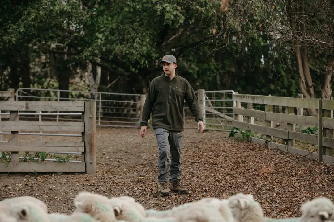 Man wearing Bushbuck Vertex Half Zip Fleece outdoor clothing for hiking and adventure