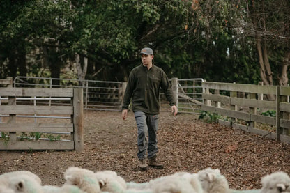 Man wearing Bushbuck Vertex Half Zip Fleece outdoor clothing for hiking and adventure