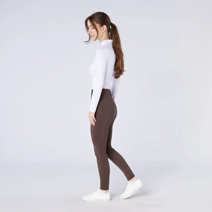 Woman in white top and brown leggings wearing Cameo All Season Tights for country clothing