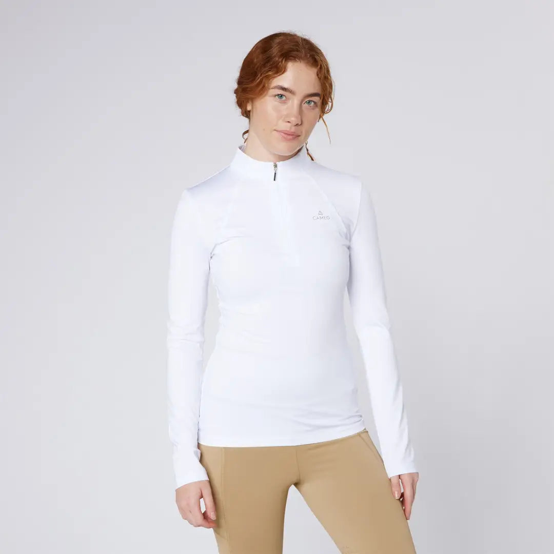 Woman in white shirt and tan leggings from Cameo Core Collection for country clothing hunting