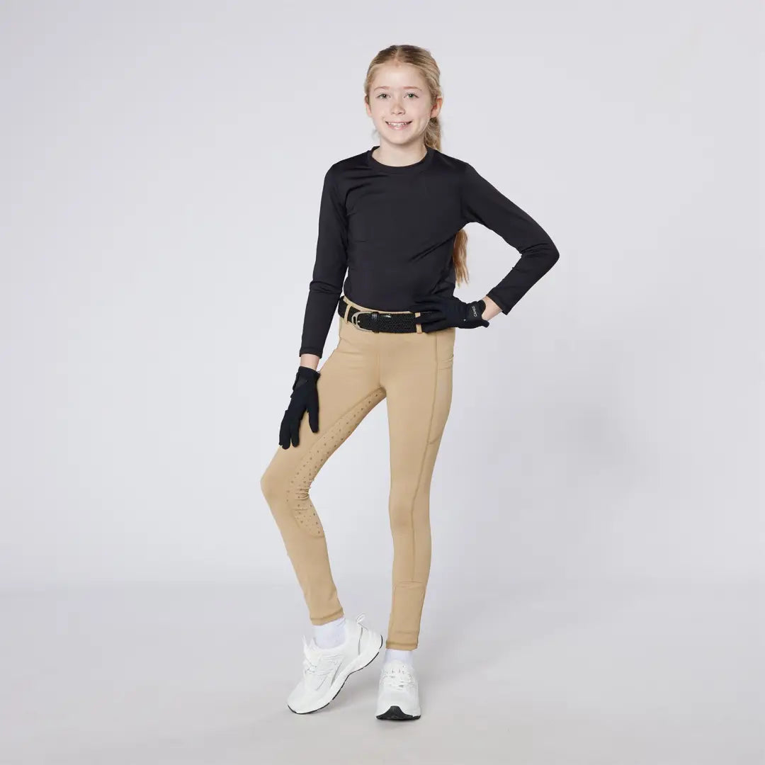 Girl in stylish Cameo Junior Performance Riding Tights for comfortable riding performance