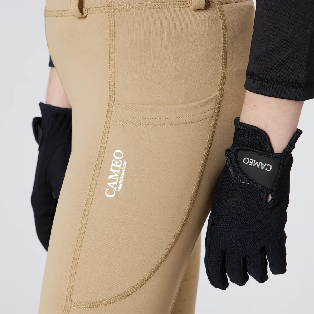 Tan riding pants with black gloves from Cameo Junior Performance Riding Tights for performance riding