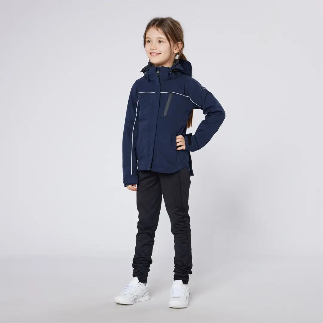 Girl in navy blue Cameo Junior Riding Jacket and black pants for junior riding style