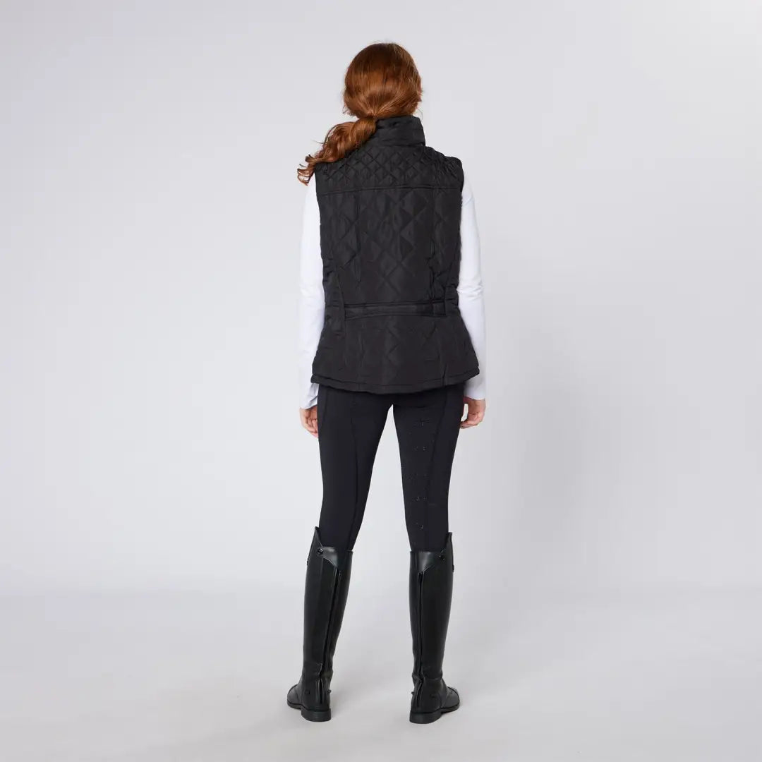Woman in black quilted vest with Cameo Performance Tights, perfect for riding tights