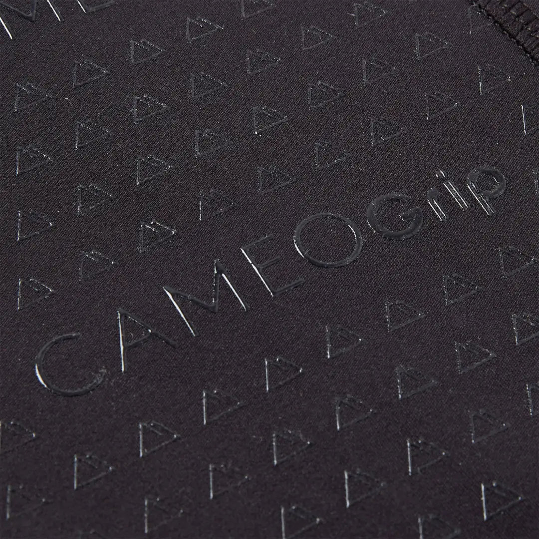 Close-up of black country clothing fabric with triangular pattern and Cameo Grip embossing