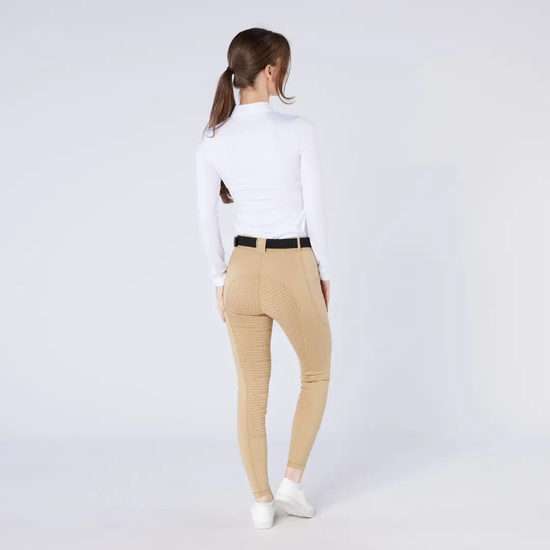 Women’s white mock neck top and tan riding pants for country clothing and outdoor riding