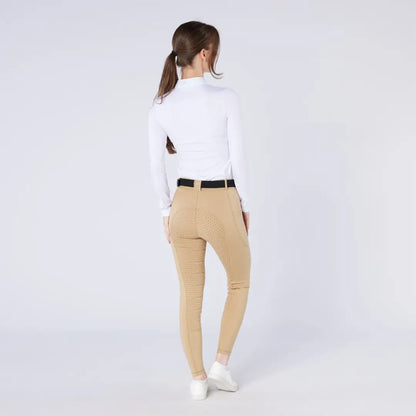 Women’s white mock neck top and tan riding pants for country clothing and outdoor riding