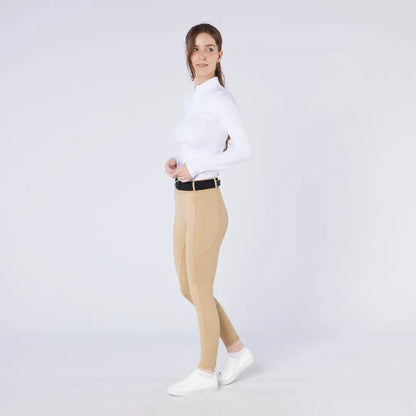Woman in white long-sleeved top and tan pants wearing Cameo ThermoDry Riding Tight outdoors