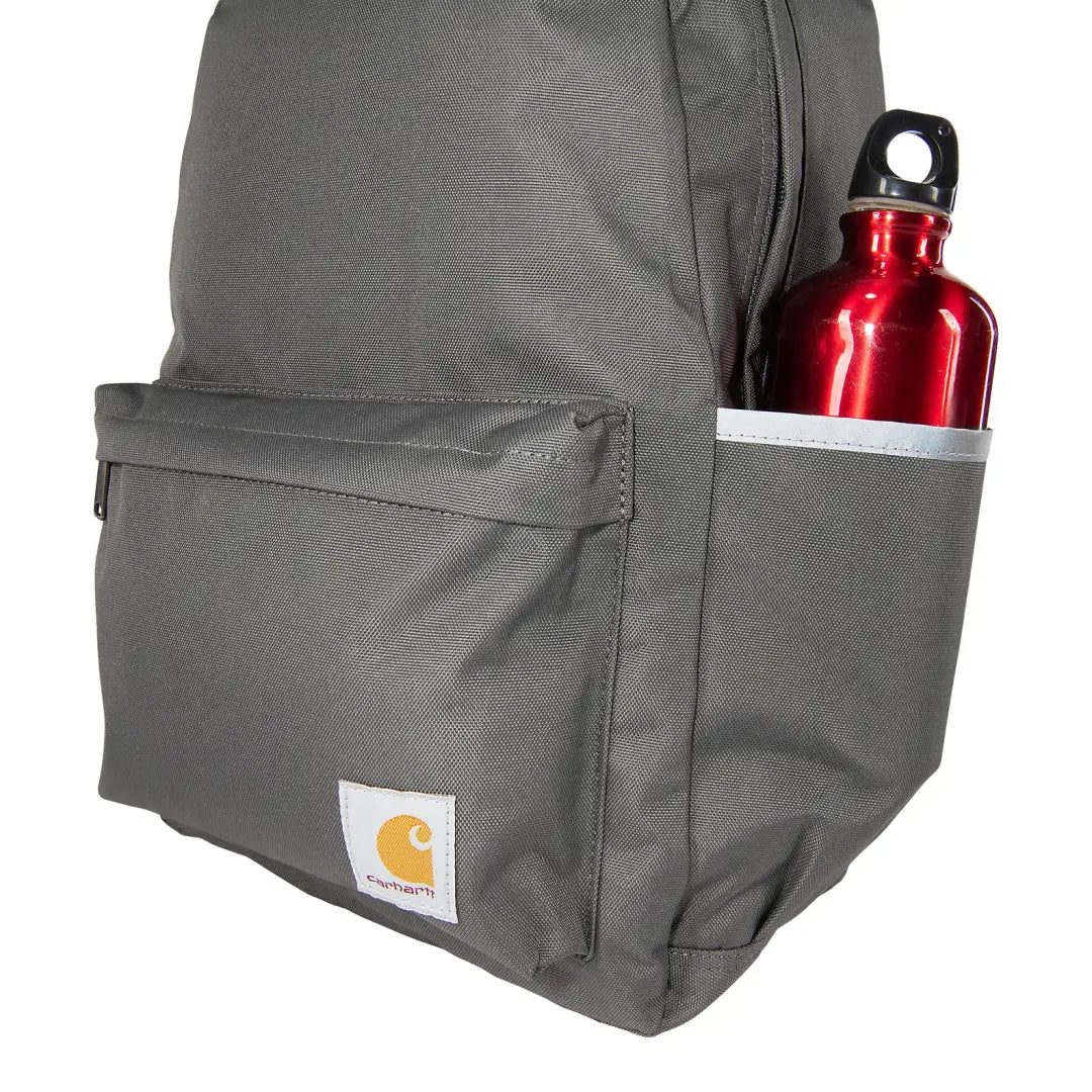 Gray Carhartt 21L Classic Laptop Backpack with red water bottle for outdoors and country clothing fans