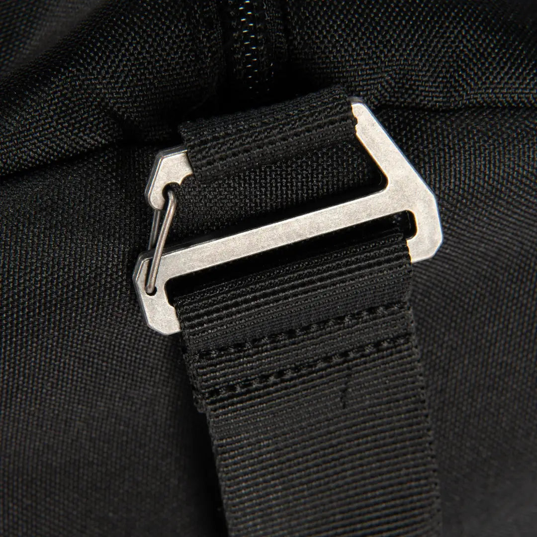 Black nylon strap with silver buckle on Carhartt 40L Classic duffel