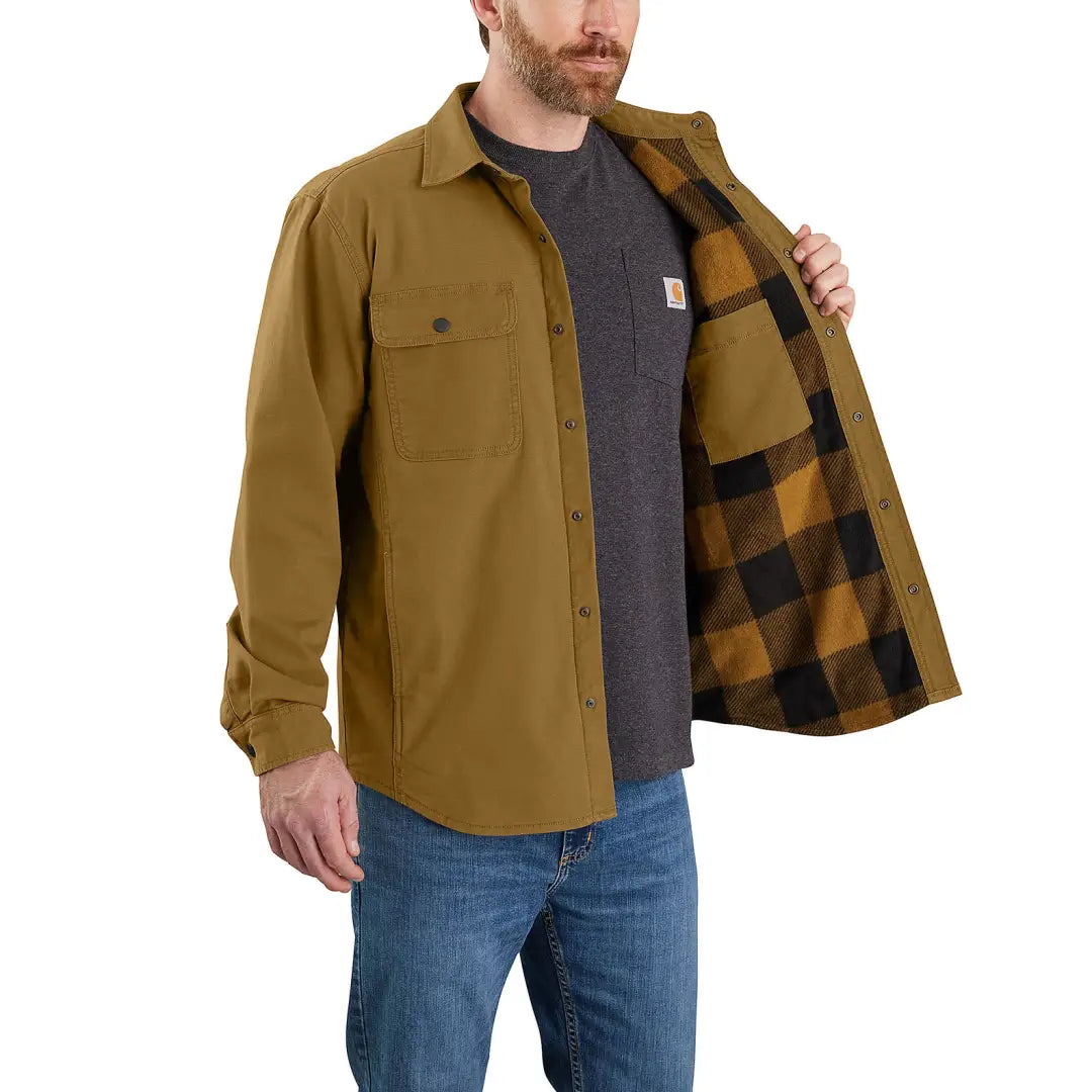 Man wearing a Carhartt Canvas Fleece Lined Shirt Jacket in brown for casual style