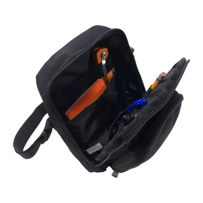 Black Carhartt crossbody zip bag with orange zipper and pen holder