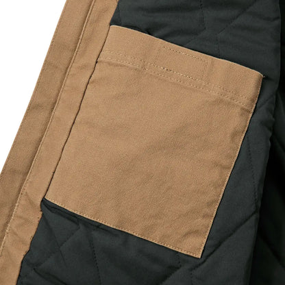 Tan jacket pocket on Carhartt Montana Rugged Flex relaxed fit duck vest for country hunting