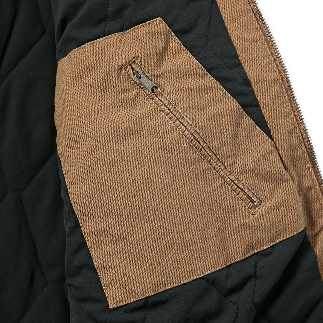 Brown jacket pocket with zipper on Carhartt Montana Rugged Flex relaxed fit duck vest for country hunting clothing