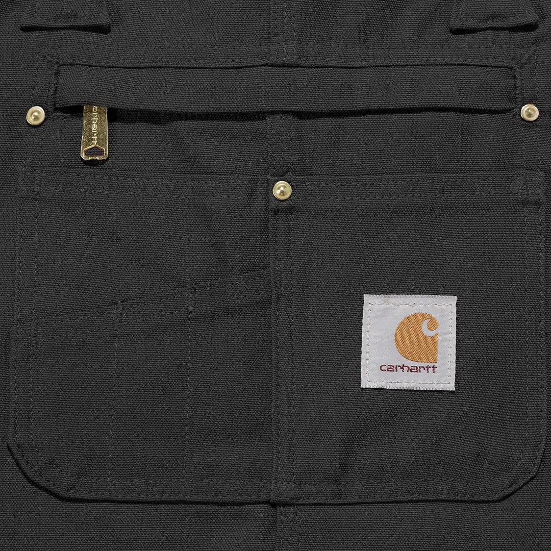 Black Carhartt workwear pocket on Relaxed Fit Duck Bib Overall for tough jobs