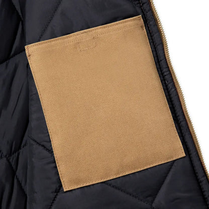 Black quilted relaxed fit Carhartt vest with rib collar and tan patch pocket
