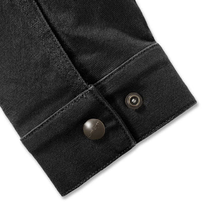 Black denim sleeve with metal buttons on Carhartt Rugged Flex outdoors jacket
