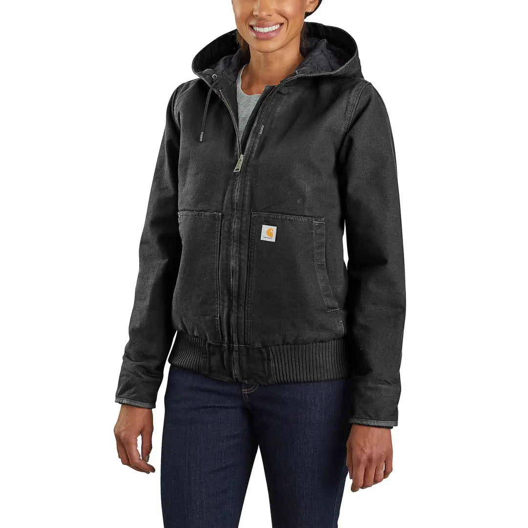 Woman in Carhartt womens loose fit washed duck insulated jacket for outdoors and hunting