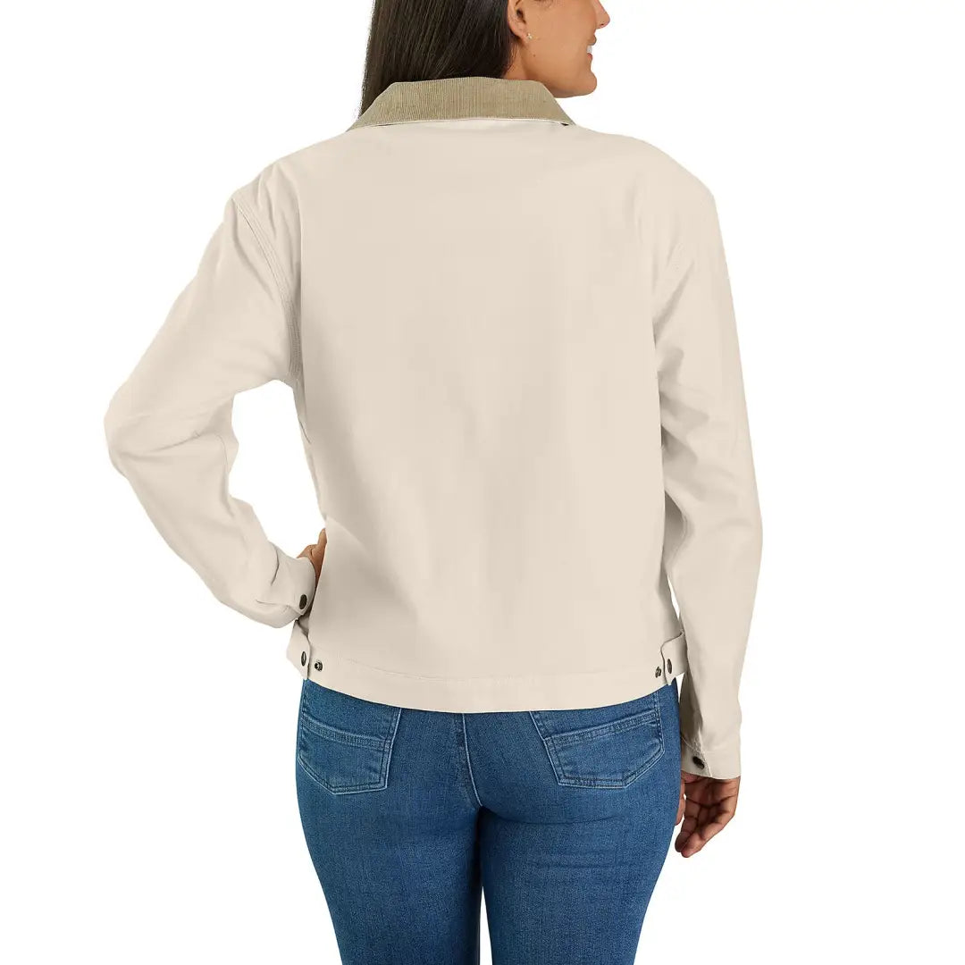 Woman wearing beige Detroit jacket with relaxed fit from Carhartt country clothing line