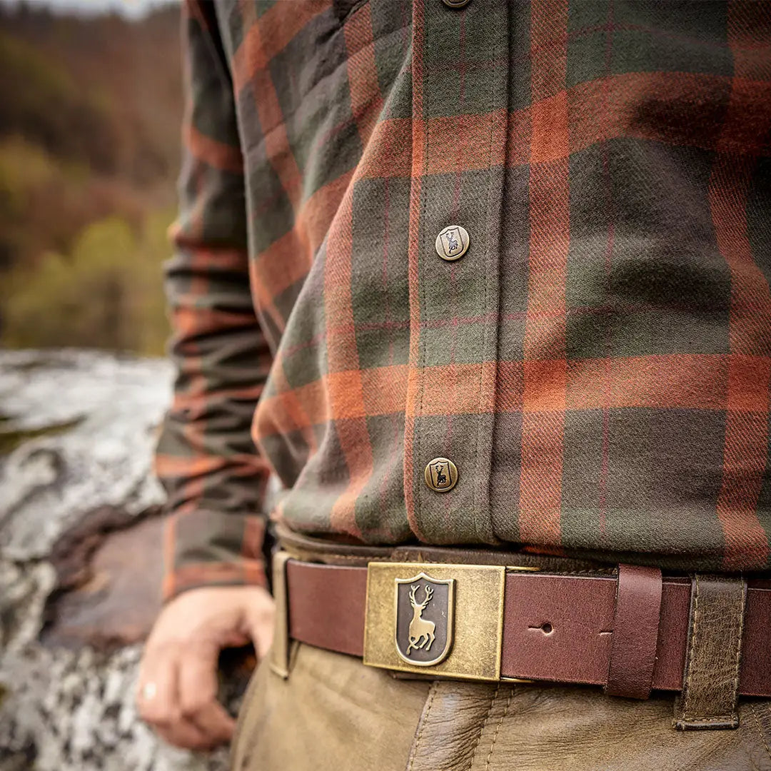 Plaid Deerhunter Ethan Shirt styled with a cool deer-buckle belt for a rugged look