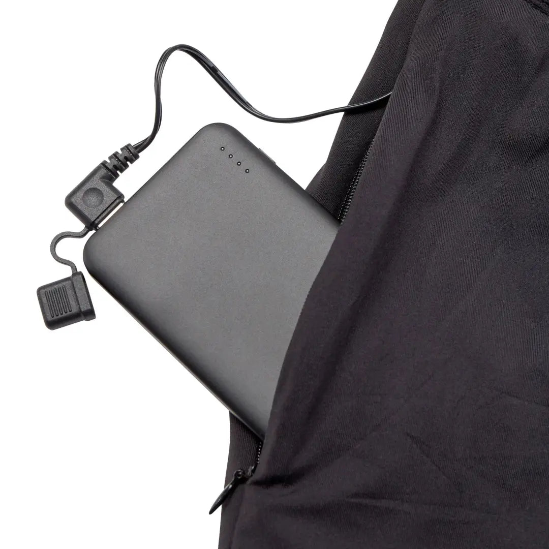 Portable battery charger in a pocket of Deerhunter Heat Long Johns for rechargeable heated long wear