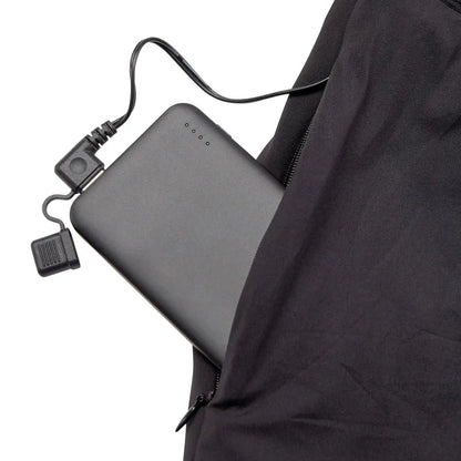 Portable battery charger in a pocket of Deerhunter Heat Long Johns for rechargeable heated long wear