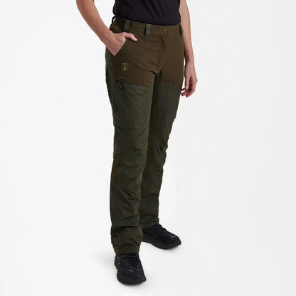 Dark green Deerhunter Lady Ann trousers with pockets worn by a stylish person