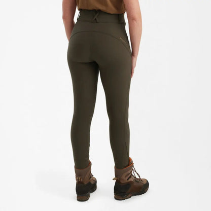 Deerhunter Lady Hunting Tights in dark olive green with hiking boots for outdoor adventures